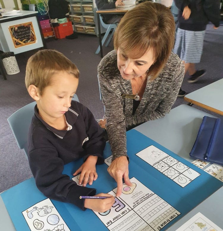 SLSO Karen Brown supporting a Trunkey Public School student
