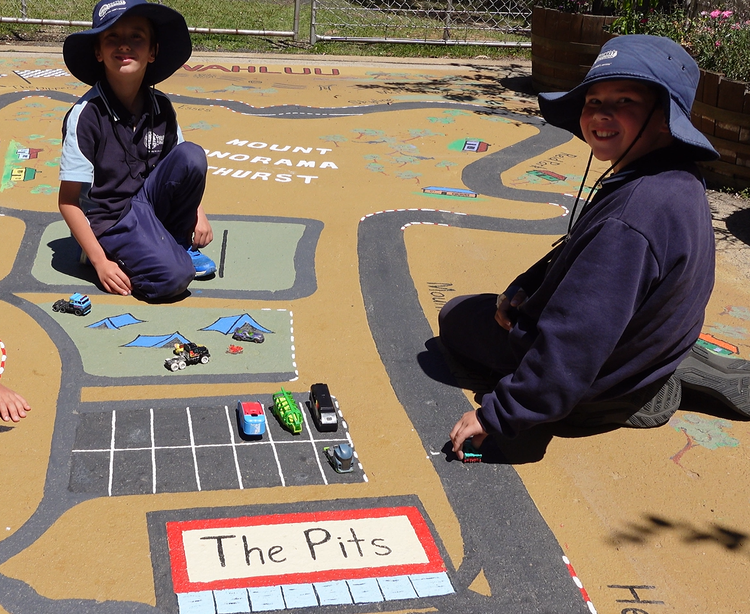 2 Trunkey Public School students playing on the racing car track