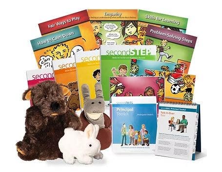 A collection of second step program posters, workbooks, toolkits and puppets