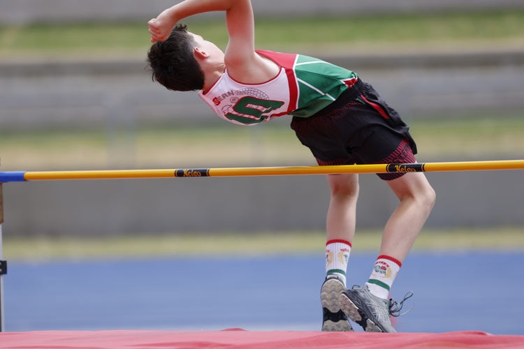 Trunkey Public School student, George Gilbert, jumping over the bar in high jump at the state athletics carnival